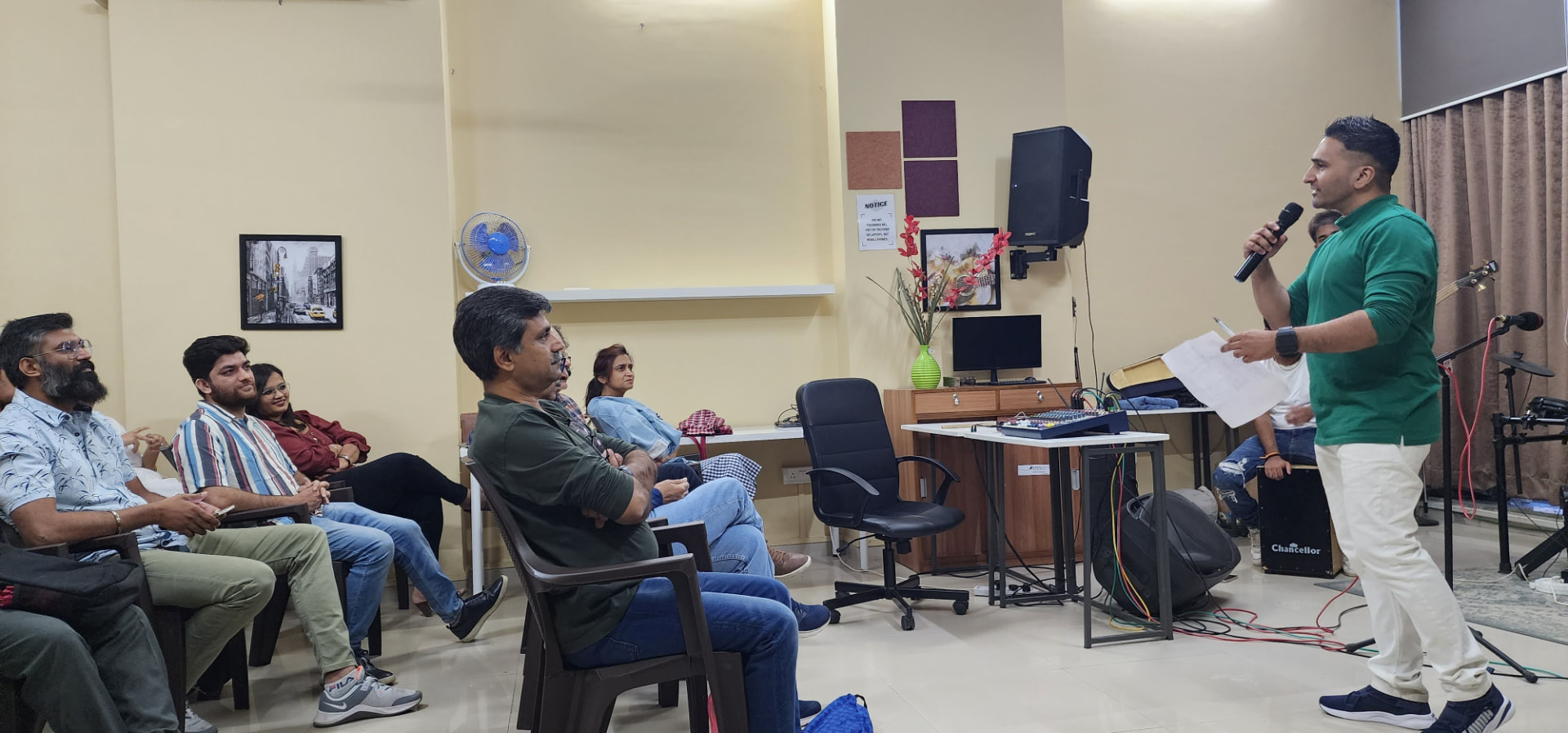 Host addressing artists at a Music Jammin session